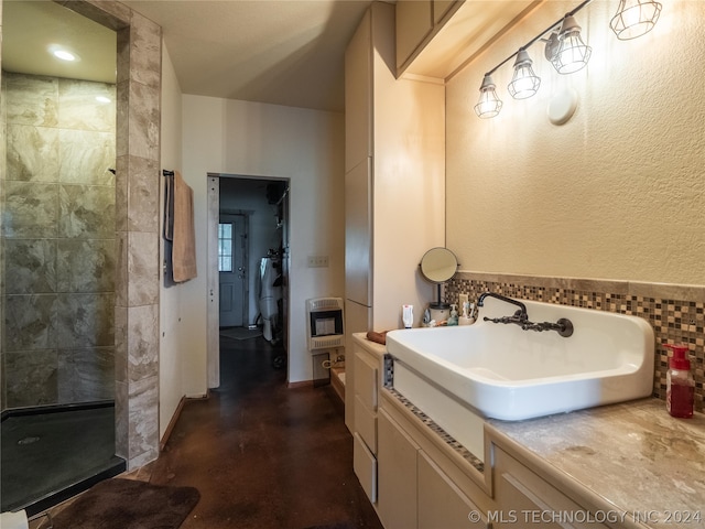 bathroom featuring vanity, concrete floors, a tile shower, and heating unit