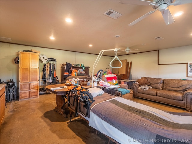 bedroom featuring ceiling fan and concrete floors