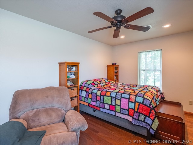 bedroom with ceiling fan and wood-type flooring