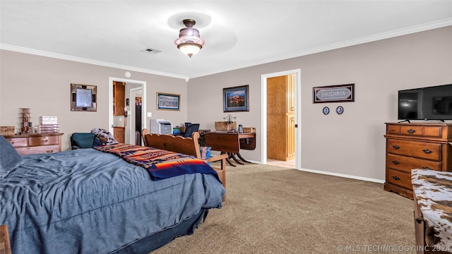 carpeted bedroom with ceiling fan, crown molding, and connected bathroom