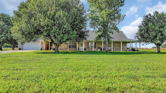 view of front of house with a front yard and a garage