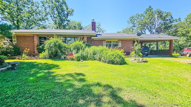 ranch-style house with a carport and a front yard