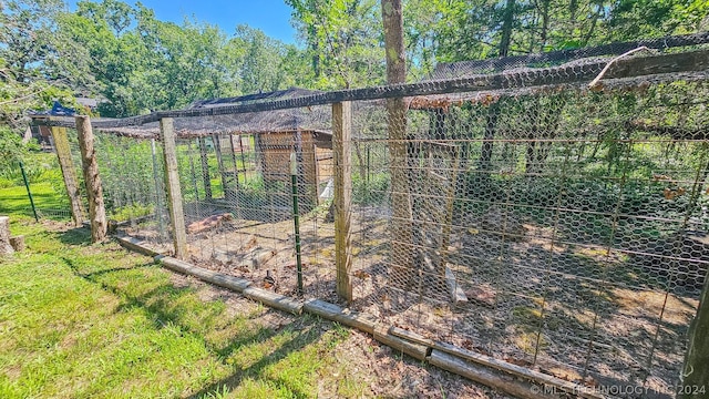 view of gate with exterior structure and an outdoor structure