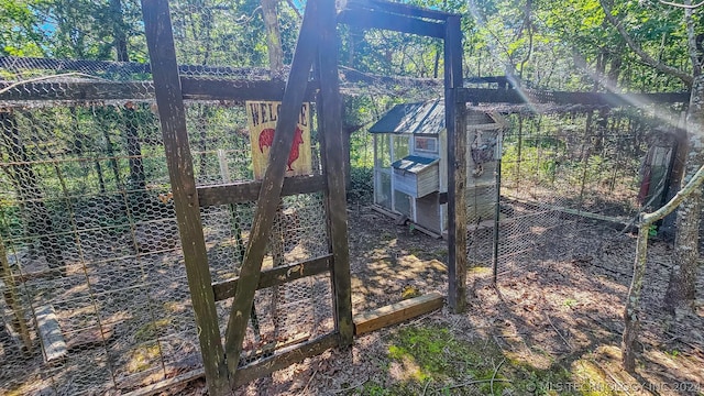 view of gate with exterior structure and an outdoor structure