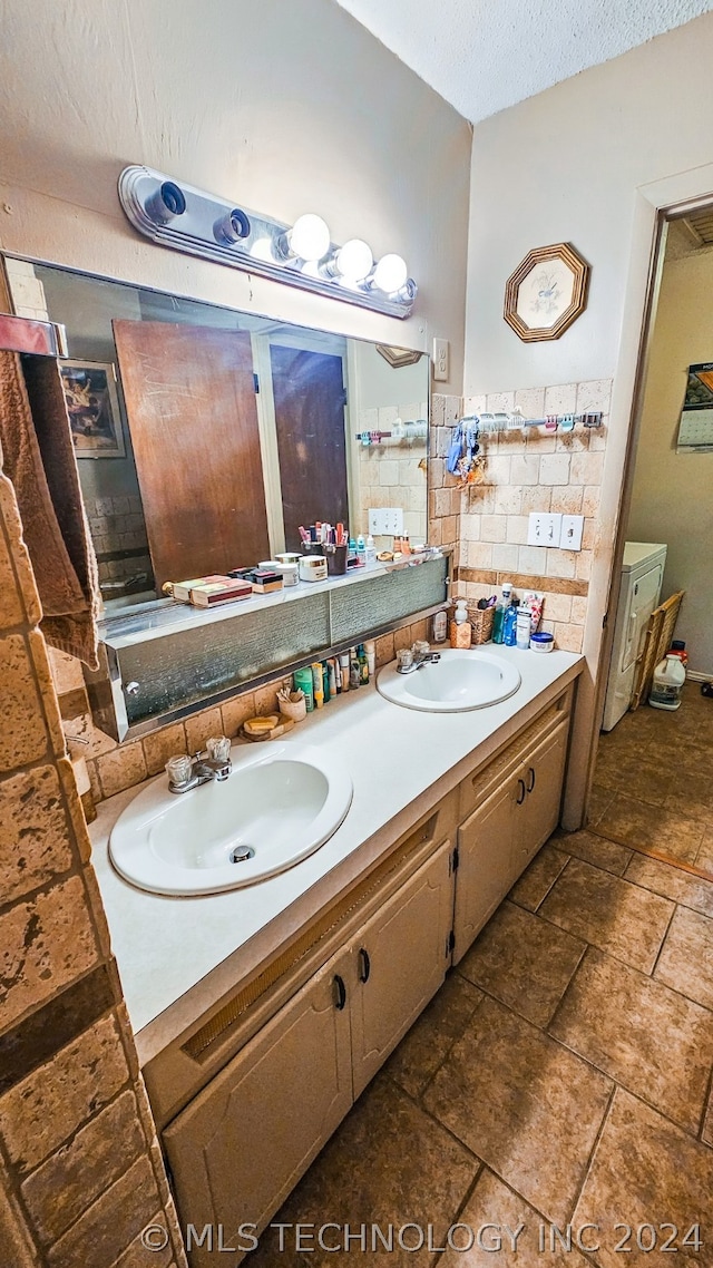 bathroom featuring vanity and a textured ceiling