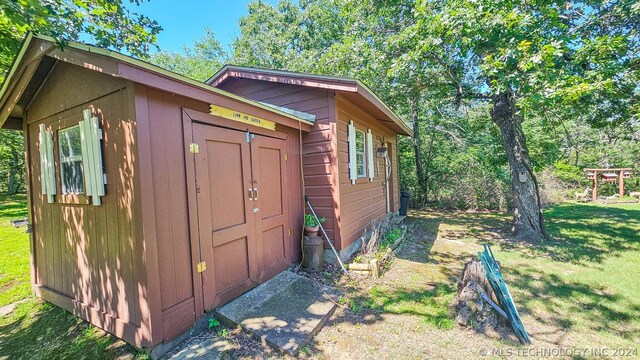 view of outdoor structure with a yard