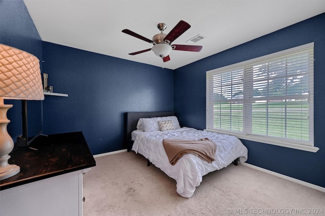 carpeted bedroom featuring ceiling fan