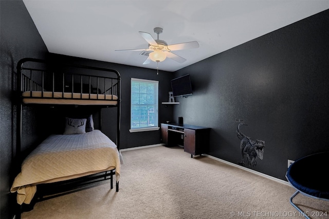 bedroom with ceiling fan and light carpet