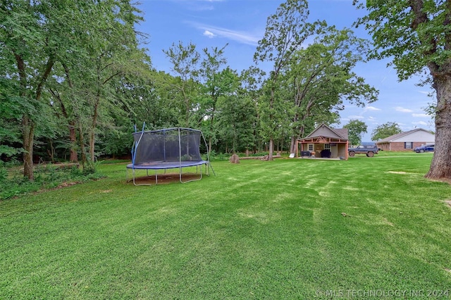 view of yard featuring a trampoline