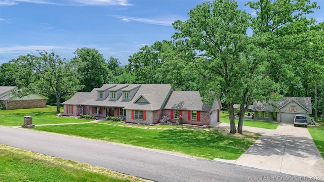 view of front of house with a porch, a front yard, and a garage