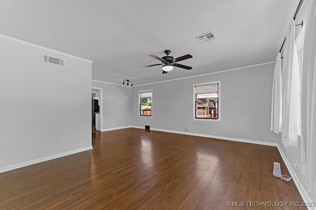 unfurnished room with crown molding, dark wood-type flooring, and ceiling fan