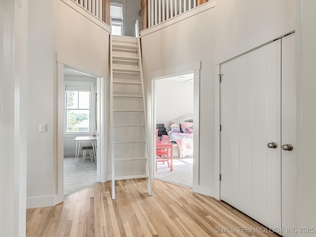 75 Lower Green Way, Carlton Landing, OK 74432 - foyer entrance with light wood-style floors, a towering ceiling, and baseboards