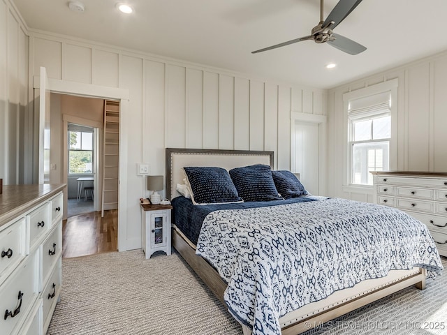 75 Lower Green Way, Carlton Landing, OK 74432 - bedroom with multiple windows, a decorative wall, recessed lighting, and a ceiling fan