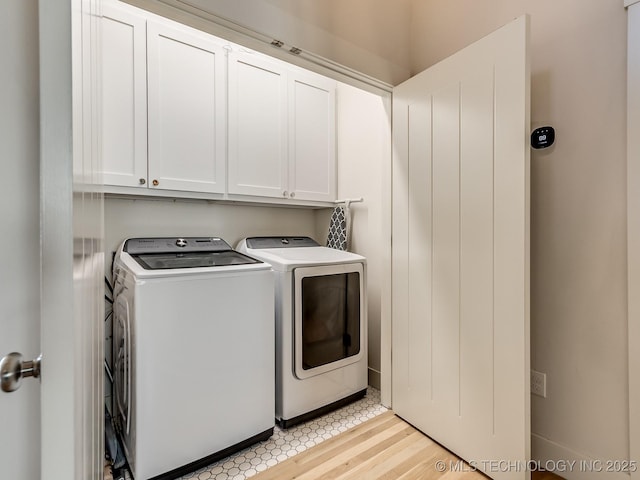 75 Lower Green Way, Carlton Landing, OK 74432 - washroom featuring washing machine and clothes dryer, cabinet space, and light wood-type flooring