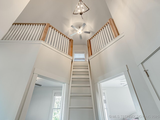 75 Lower Green Way, Carlton Landing, OK 74432 - staircase featuring a high ceiling, healthy amount of natural light, and a ceiling fan