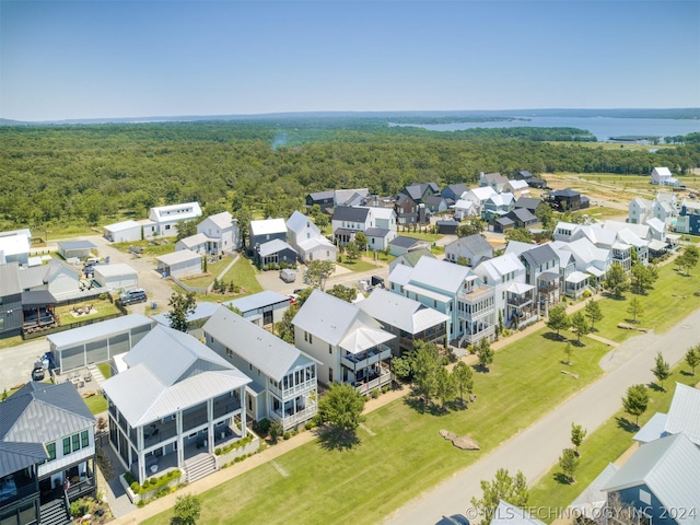 aerial view featuring a residential view and a wooded view