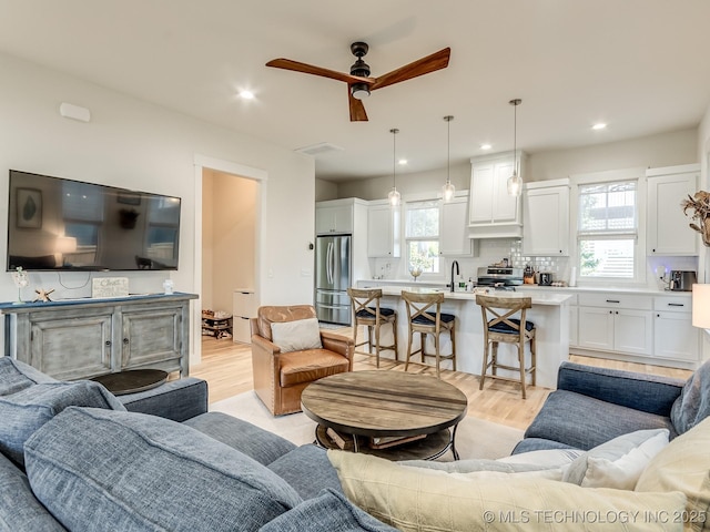 75 Lower Green Way, Carlton Landing, OK 74432 - living area with light wood-style floors, a ceiling fan, plenty of natural light, and recessed lighting