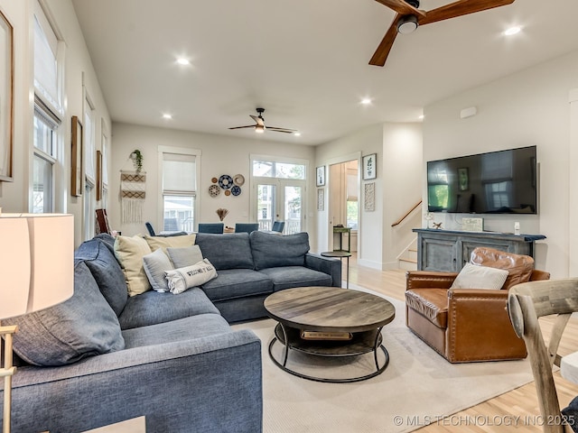 75 Lower Green Way, Carlton Landing, OK 74432 - living room with ceiling fan, light wood finished floors, recessed lighting, and stairs