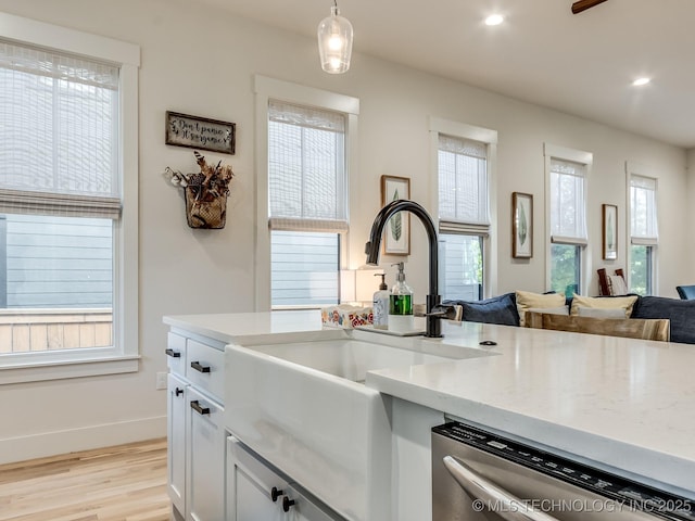 75 Lower Green Way, Carlton Landing, OK 74432 - kitchen with a sink, stainless steel dishwasher, healthy amount of natural light, open floor plan, and recessed lighting