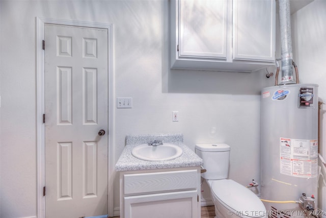 bathroom featuring water heater, toilet, and vanity