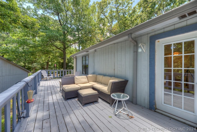 wooden deck featuring an outdoor hangout area