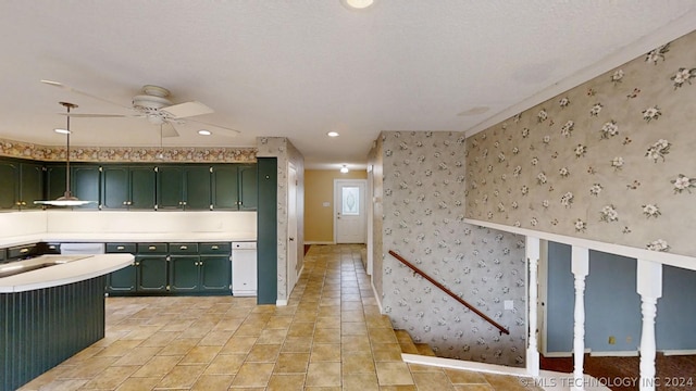 kitchen with ceiling fan and green cabinetry