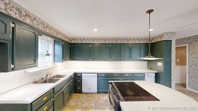 kitchen featuring dishwasher, sink, green cabinets, and decorative light fixtures