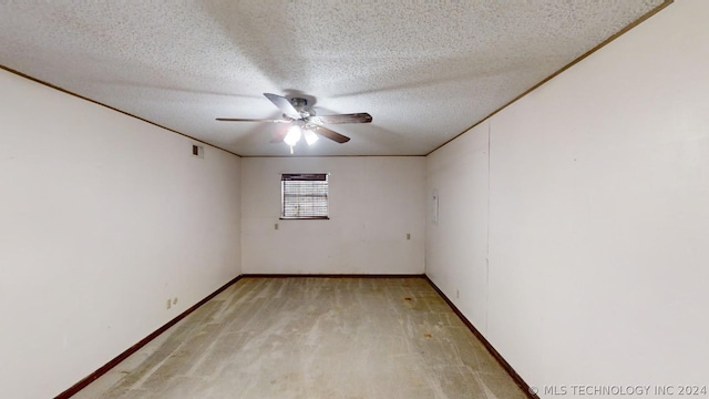 empty room featuring crown molding, ceiling fan, a textured ceiling, and light wood-type flooring