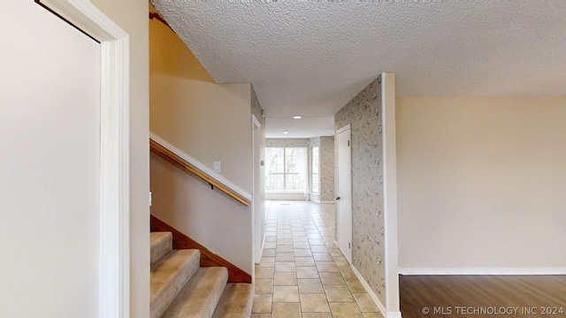 corridor with a textured ceiling