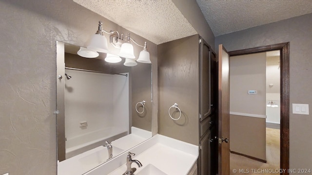 bathroom featuring vanity and a textured ceiling