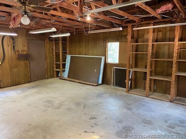 interior space featuring wooden walls