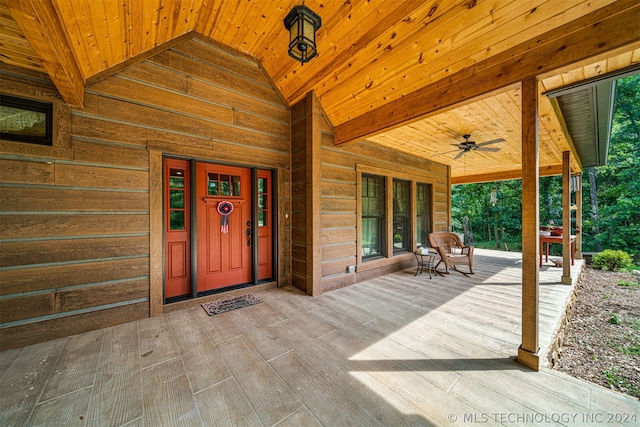 entrance to property featuring ceiling fan