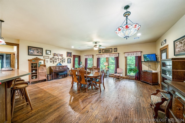 dining space featuring ceiling fan and hardwood / wood-style flooring