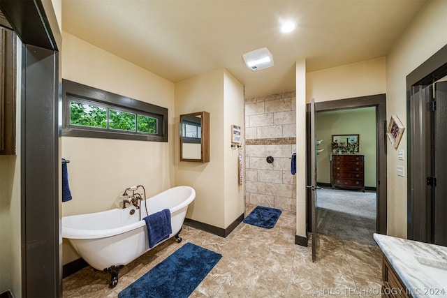 bathroom with tile floors and shower with separate bathtub