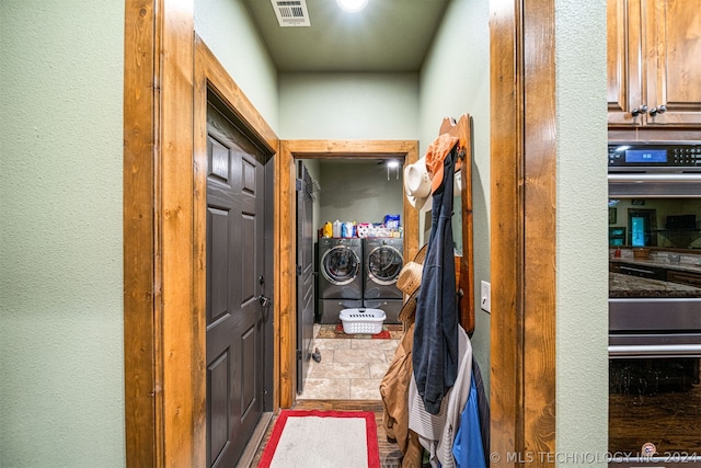 hall featuring independent washer and dryer