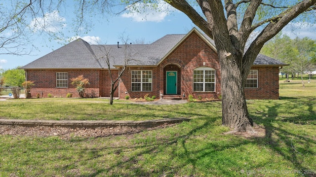 1805 College Park Rd, Claremore, OK 74017 - view of front facade with brick siding, a front lawn, and a shingled roof