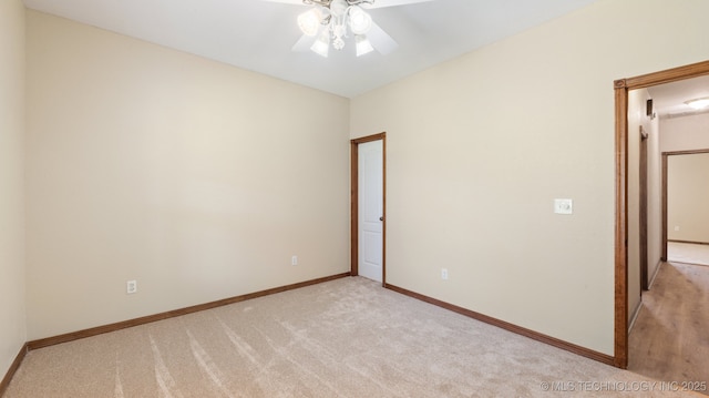 1805 College Park Rd, Claremore, OK 74017 - empty room featuring light colored carpet, a ceiling fan, and baseboards
