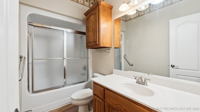 1805 College Park Rd, Claremore, OK 74017 - bathroom with toilet, vanity, and bath / shower combo with glass door