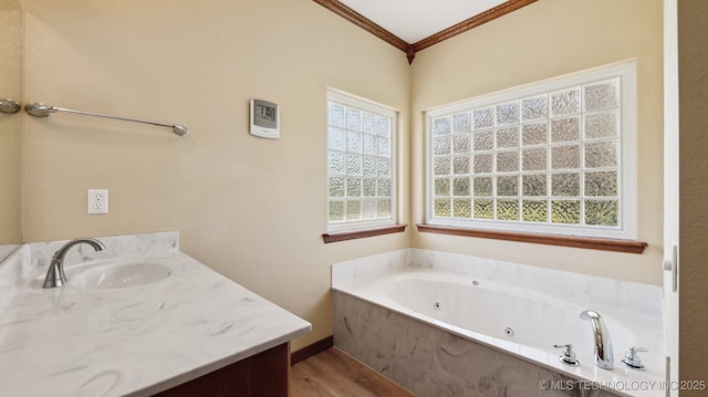 1805 College Park Rd, Claremore, OK 74017 - full bathroom featuring vanity, ornamental molding, a tub with jets, and wood finished floors