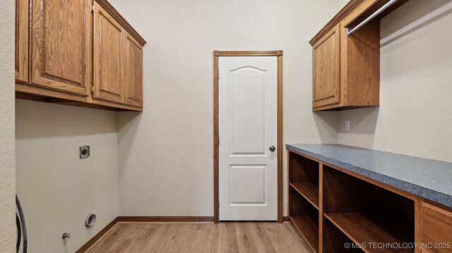 1805 College Park Rd, Claremore, OK 74017 - laundry area with light wood-style floors, gas dryer hookup, electric dryer hookup, cabinet space, and baseboards