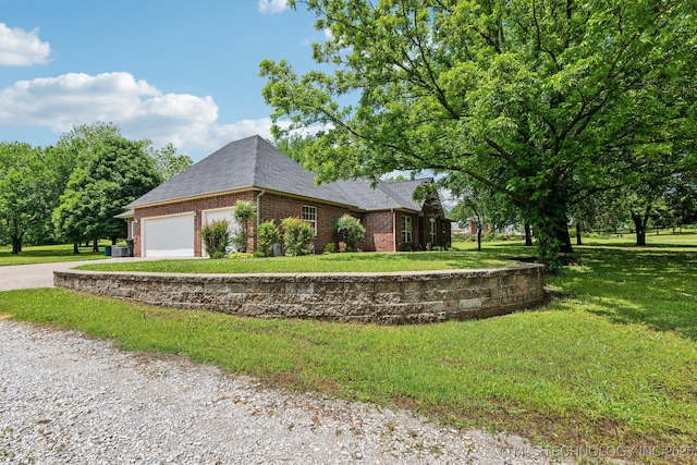 1805 College Park Rd, Claremore, OK 74017 - view of side of home with brick siding, concrete driveway, an attached garage, a lawn, and a shingled roof