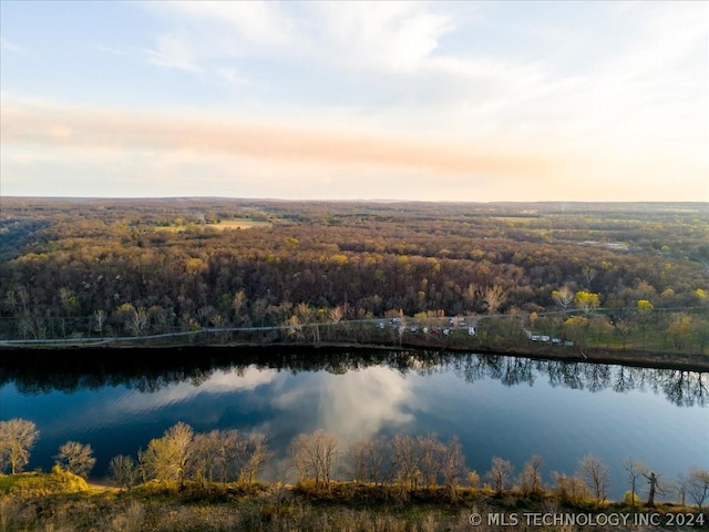 aerial view at dusk with a water view