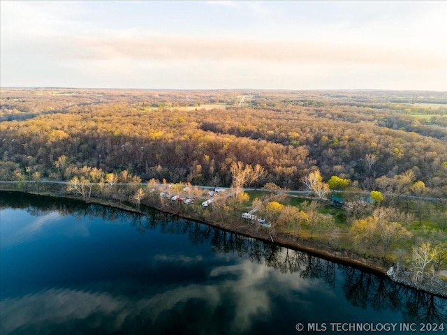 aerial view at dusk with a water view