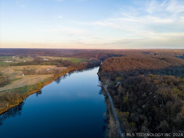 aerial view at dusk with a water view