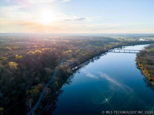 aerial view at dusk with a water view