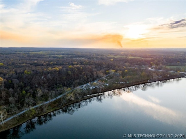 aerial view at dusk with a water view