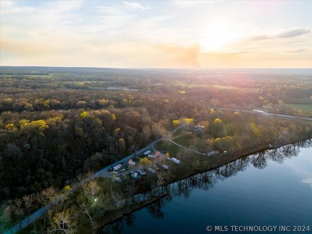 aerial view at dusk with a water view