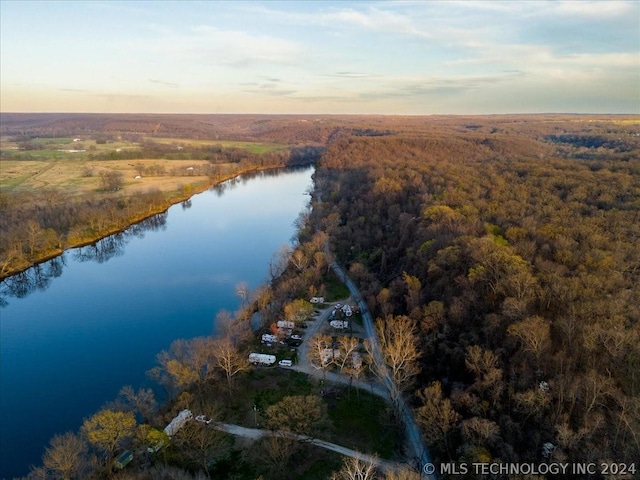 aerial view at dusk with a water view