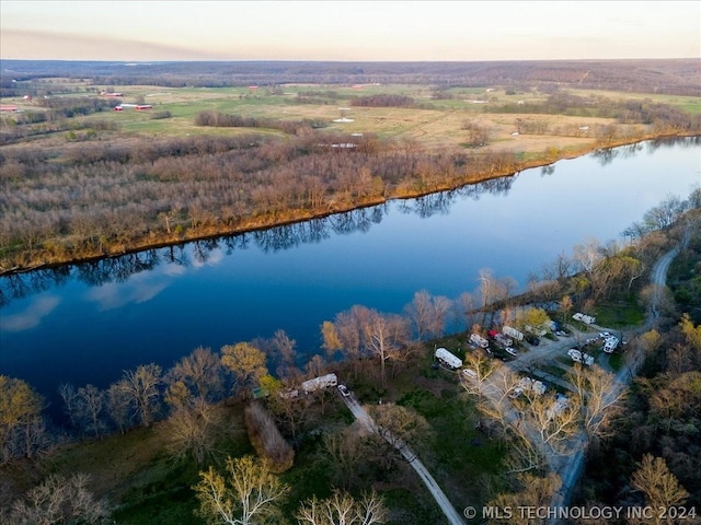 aerial view at dusk with a water view