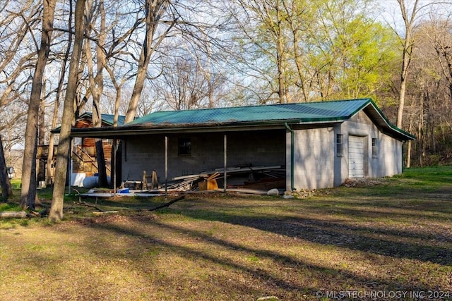 view of outbuilding featuring a yard and a garage